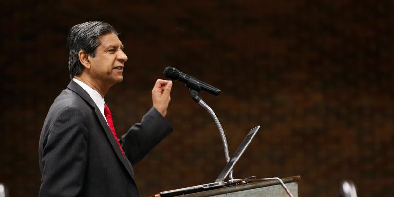 Anil Makhija speaking at a podium