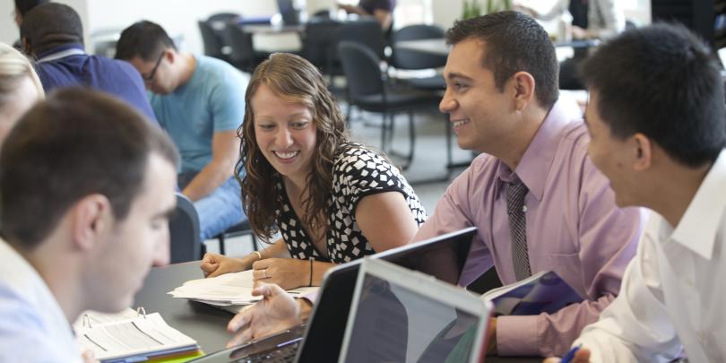 Students participating in group project meeting.