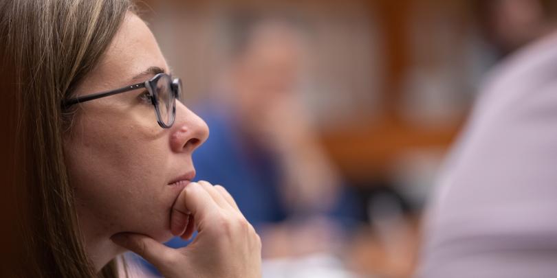 woman thinking with hand on chin