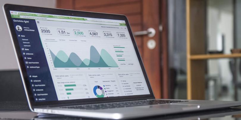 Laptop with graphs on the screen.