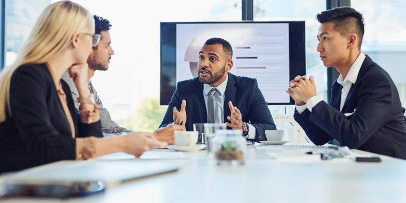 People speaking in a boardroom