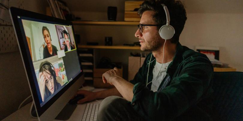 Man looking at video call on computer screen