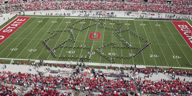 Ohio State Marching Band at Ohio Stadium Making Recycle Emblem