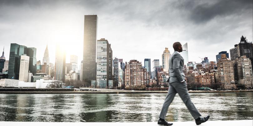 Successful business man looking away against the skyline stock photo