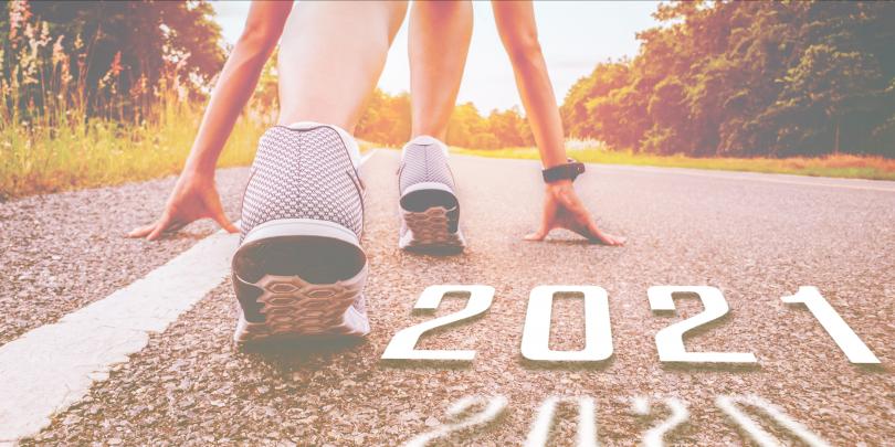 Person getting ready to race with "2021" written on the pavement