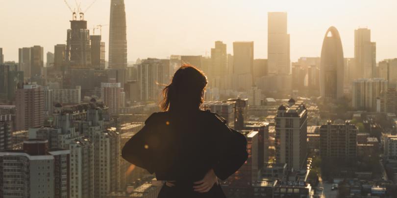 Woman alone looking out over the city
