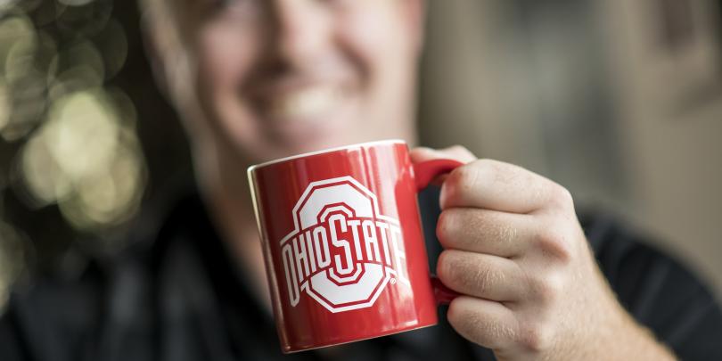 Man holding Ohio State mug