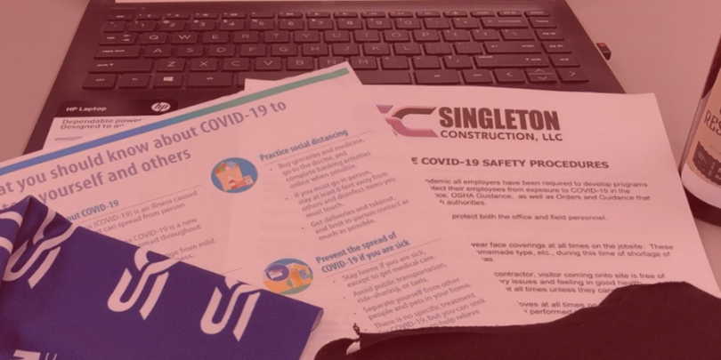 Laptop & papers with Singleton logo and Covid-19 guidelines