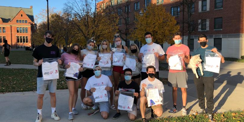 A group of students from Fisher Impact Day posing outside