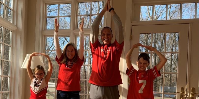 Dawn Lyons, husband, daughter and son posing O-H-I-O