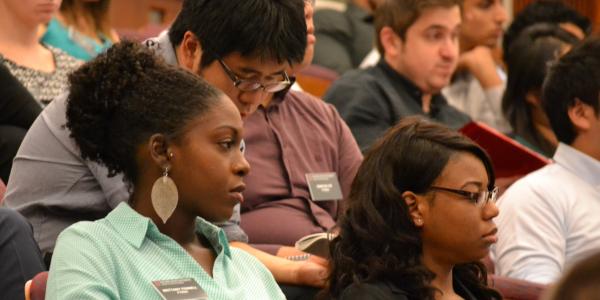 Students watch Angela Guy's presentation about the power of diverse teams.