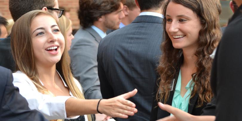 Fisher students shaking hands